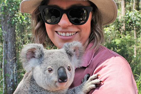 HQP employee holding a koala at Yurol plantation forest, a conservation handback area